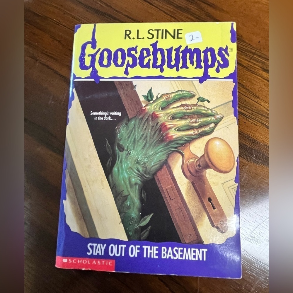Scholastic Goosebumps Book with Green and Purple Cover